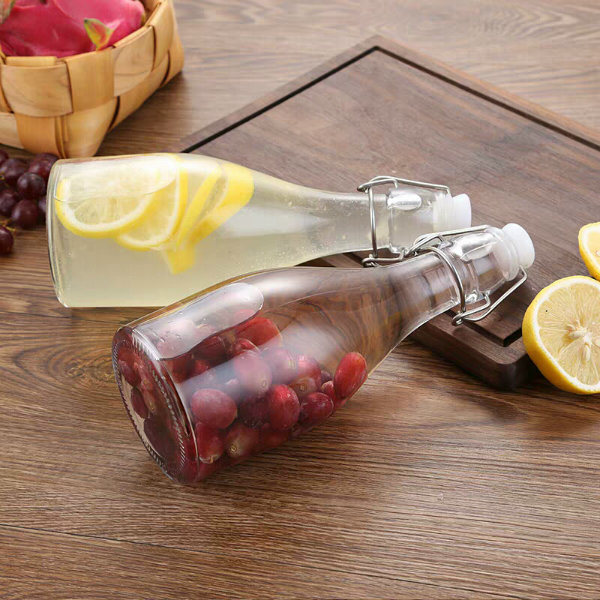 Hot Selling Transparent Glass Juice Bottles with Sealed Clasps