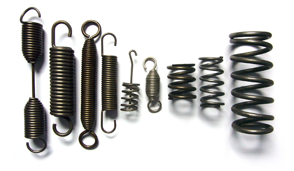 Extension/torsion/tower compression springs